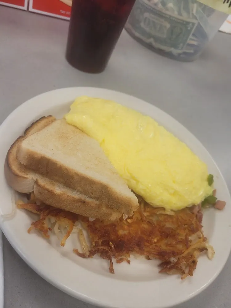 Two Eggs SNY Style with White Toast Bacon and Hash Browns